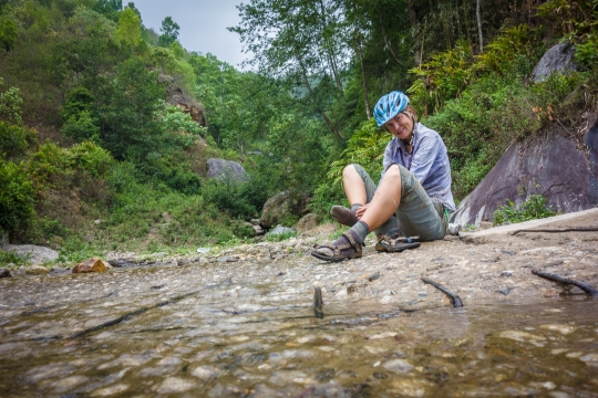 Cleaning feet in stream