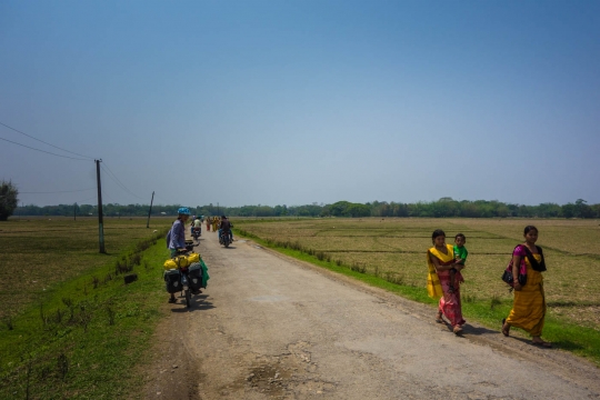 Roads through countryside with beautiful dressed women