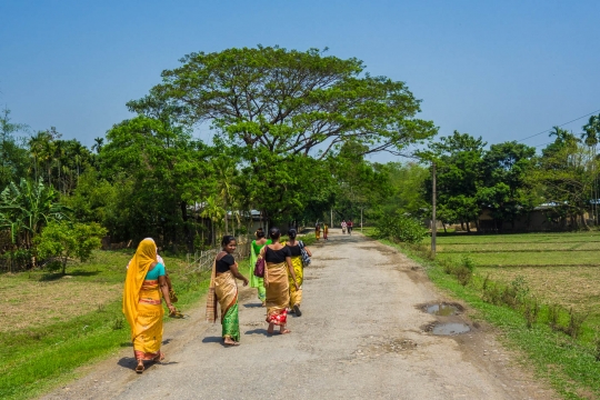 Roads through countryside with beautiful dressed women
