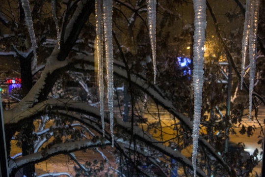 Icicles down the window of the apartment