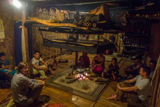 Talking with family around fire place
