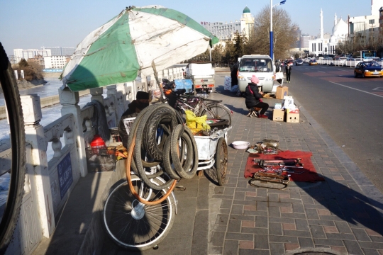 Small bicycle shops on street corners
