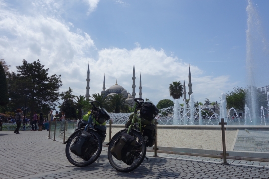 Mojo and Isaba with blue mosque