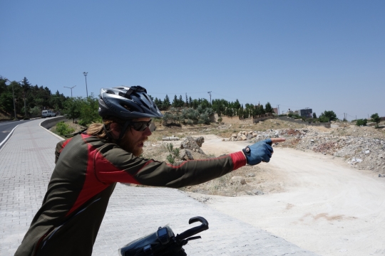 Martin pointing at ugly outskirts