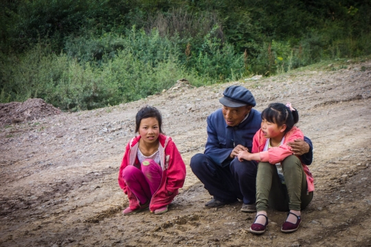 Two small girls and very gentle old man