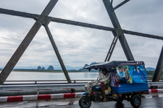 Tuk Tuk on the bridge with rain protection