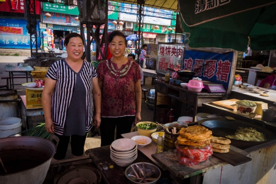 Friendly women at a food market
