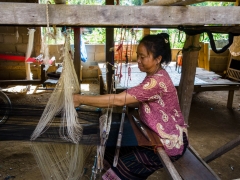 Woman weaving in village Woman weaving in village