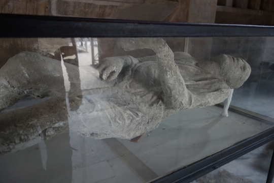 Stoned man with folds in clothes