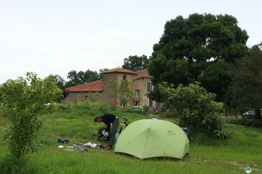 Camping by a farmer and getting ready for cooking.