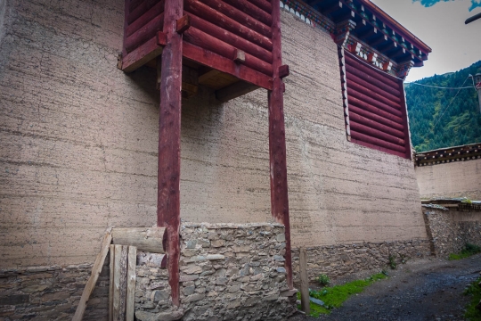 A toilet outhouse with free drop