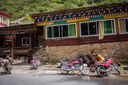 Monks washing their motor bikes