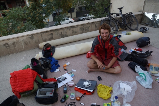 Robin with all his stuff spread out on the rooftop