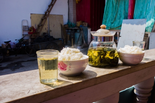 Lunchtime with tea and rice in the sun