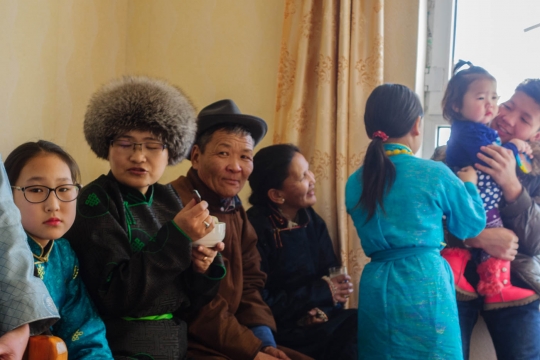 Tseegii with hat and family.