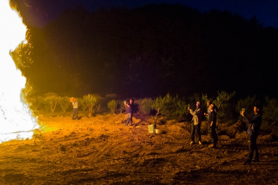 Huge campfire and farmer friends