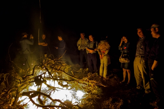 Huge campfire and farmer friends