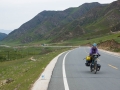 Susanne cycling up the road