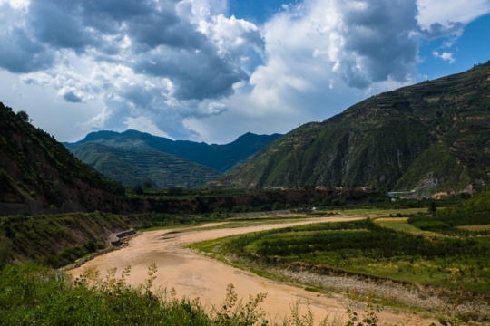 River bends and the dark sky