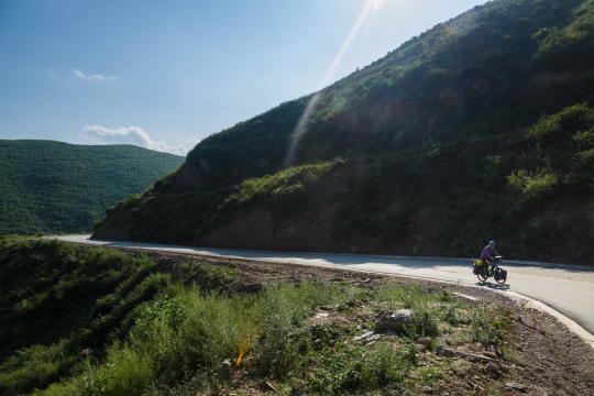 Susanne cycling up the hills
