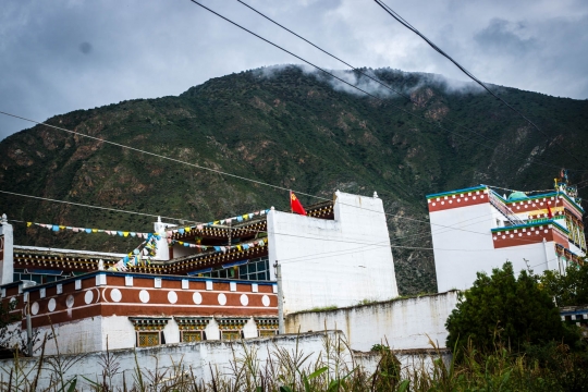 Communist flags on Tibetan house