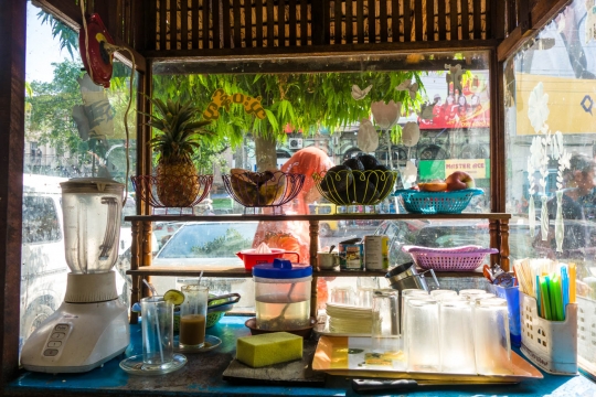 Lassi shop with a woman walking by