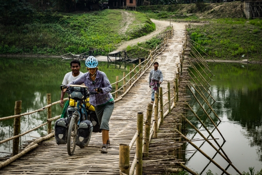 Assam, crossing rivers on bamboo