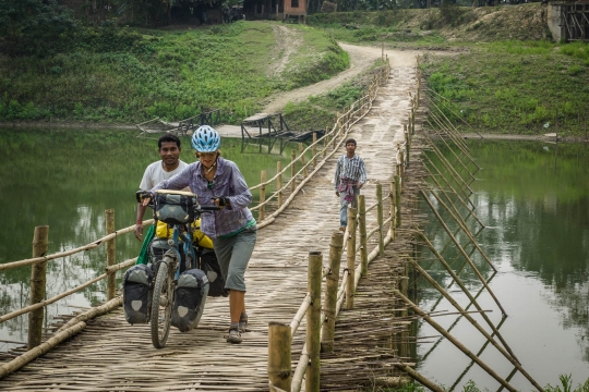 Assam, crossing rivers on bamboo