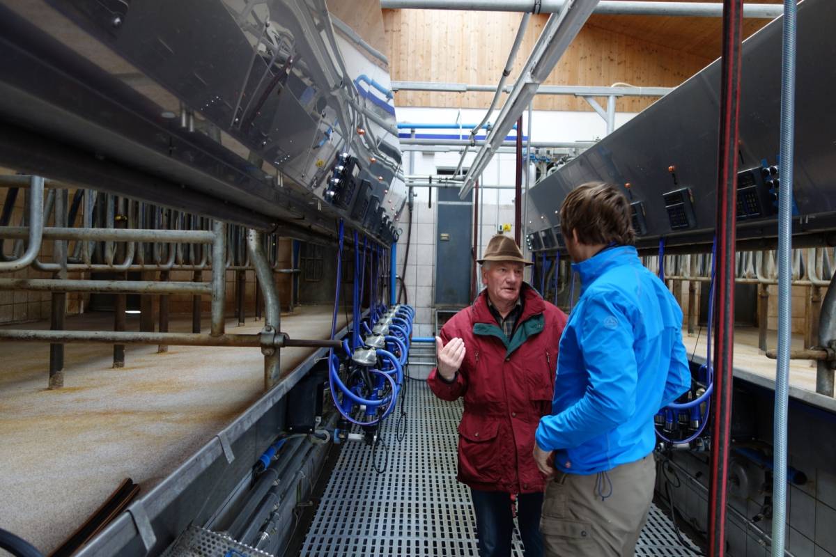 Martin and senior looking at the milk machine
